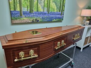 Mahogany Veneered Raised Lid Coffin